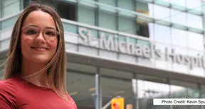 Siena McLaven standing in front of St Michaels Hospital